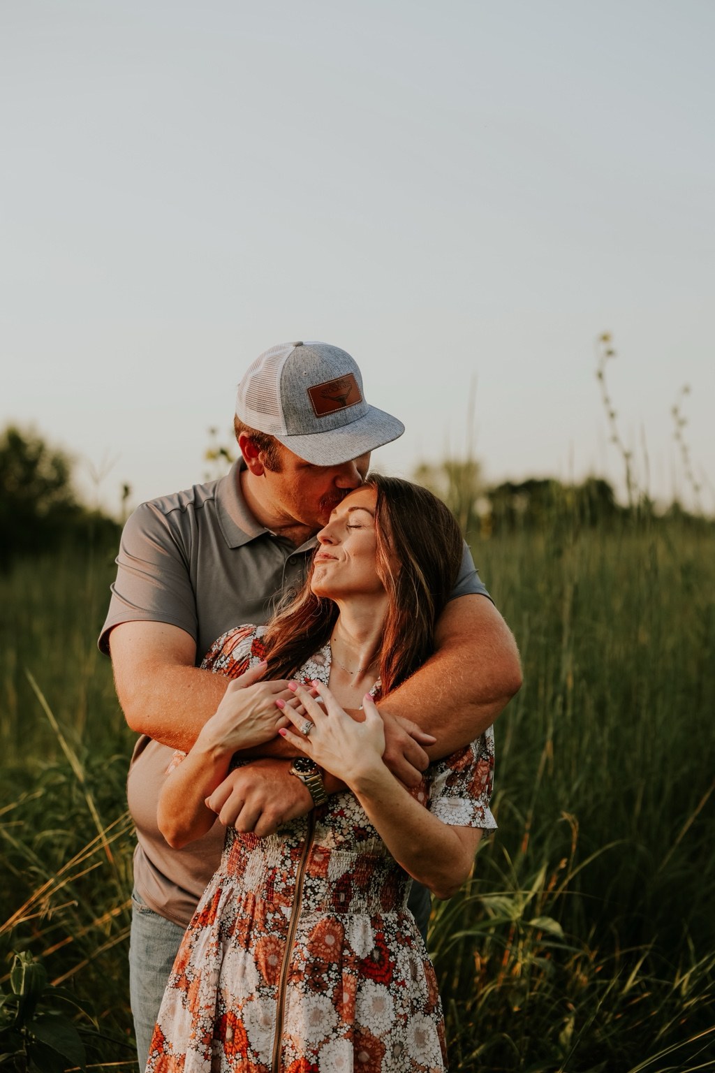 A couple embracing in evening light