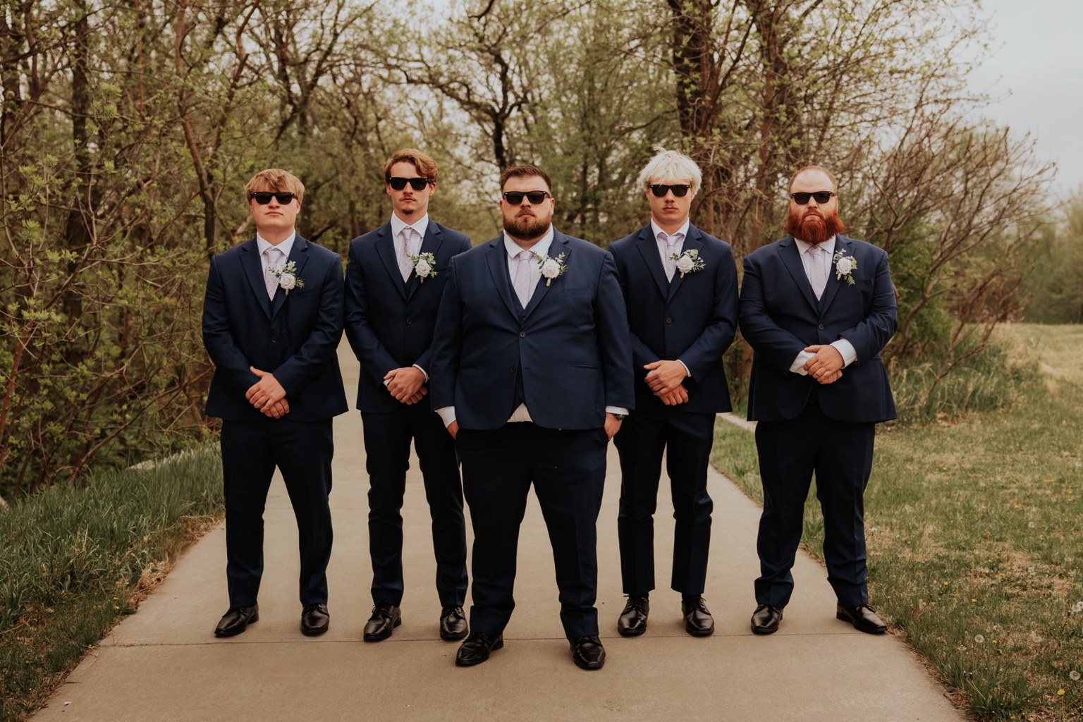 The groom and groomsmen together outdoors