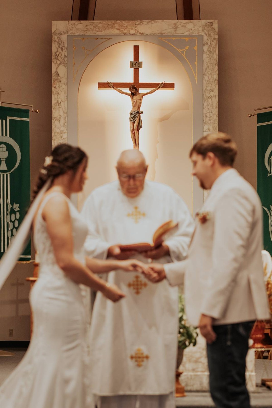 A couple holding hands during their church wedding ceremony